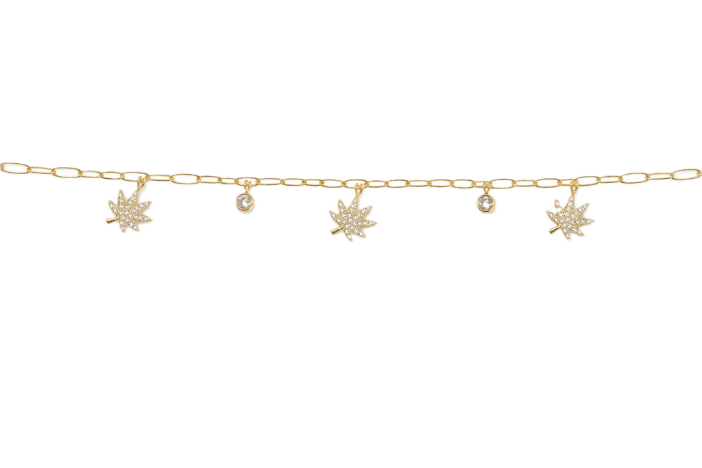 18K gold charmed bracelet with botanical charms, product shot on white background