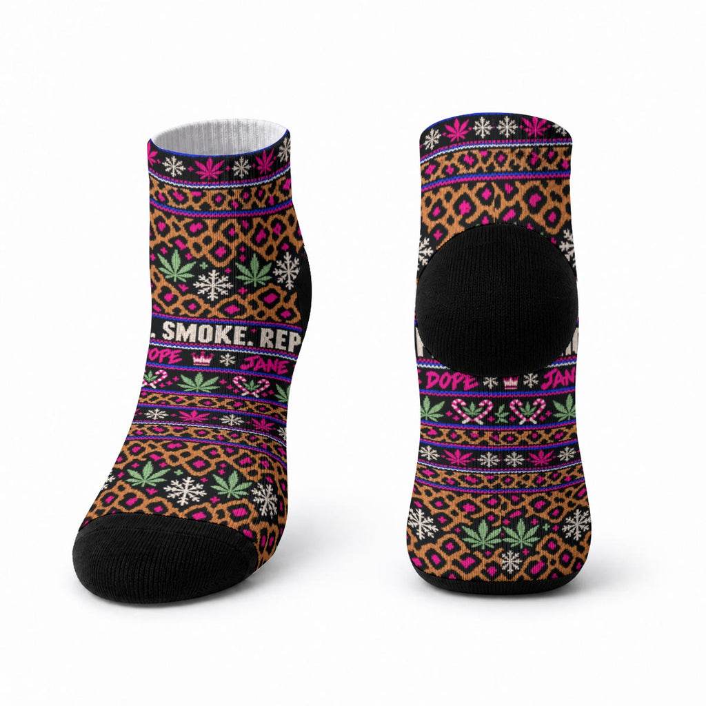 Front and back product views of Smoke Sleigh Repeat ankle socks on white, showing the holiday print and contrasting black toe and heel.