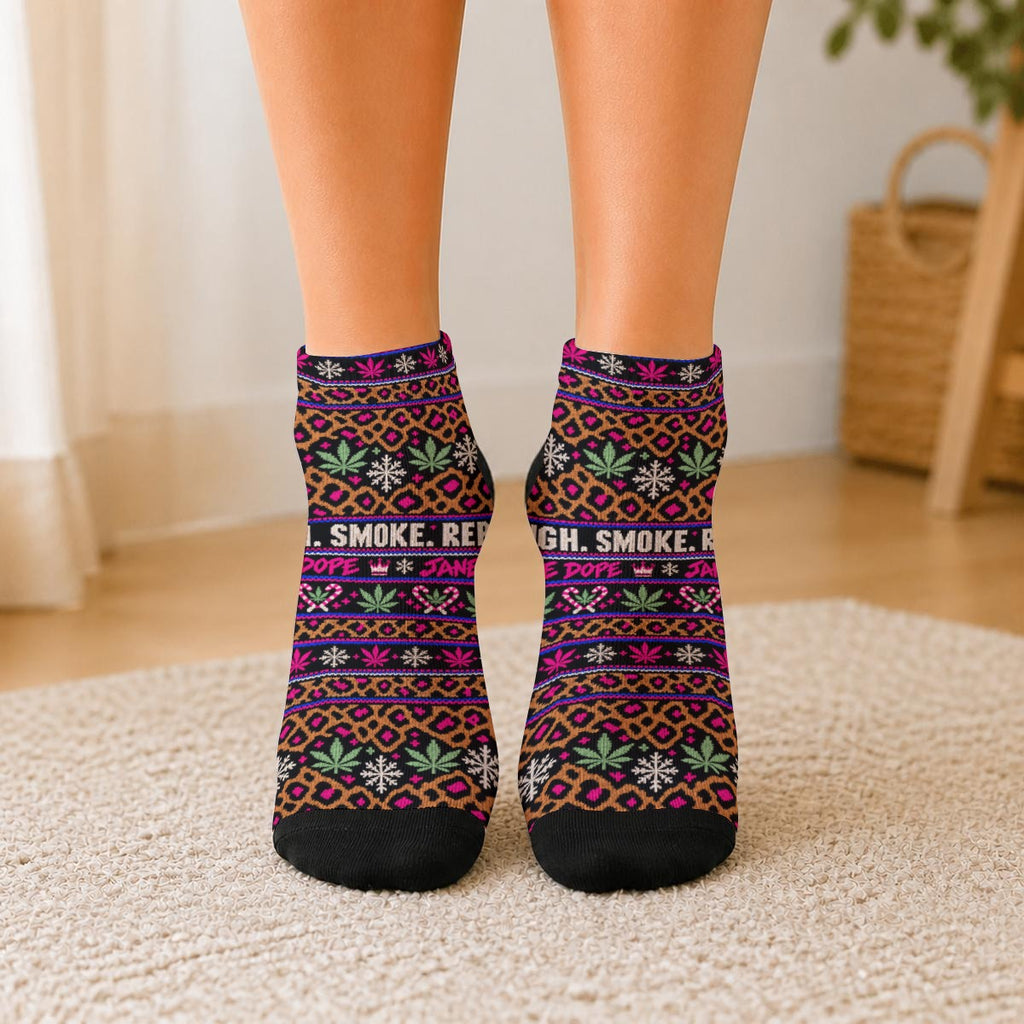 Front view of Smoke Sleigh Repeat ankle socks worn on feet, showing leopard spots, Herb motifs, snowflakes and black toes.