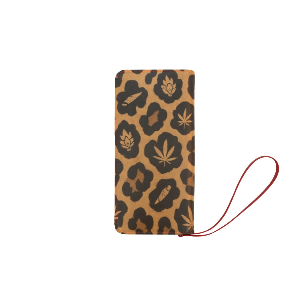 Front of the Leopard Clutch Wallet with tan-and-black Herb motifs, red stitching and a red wristlet.