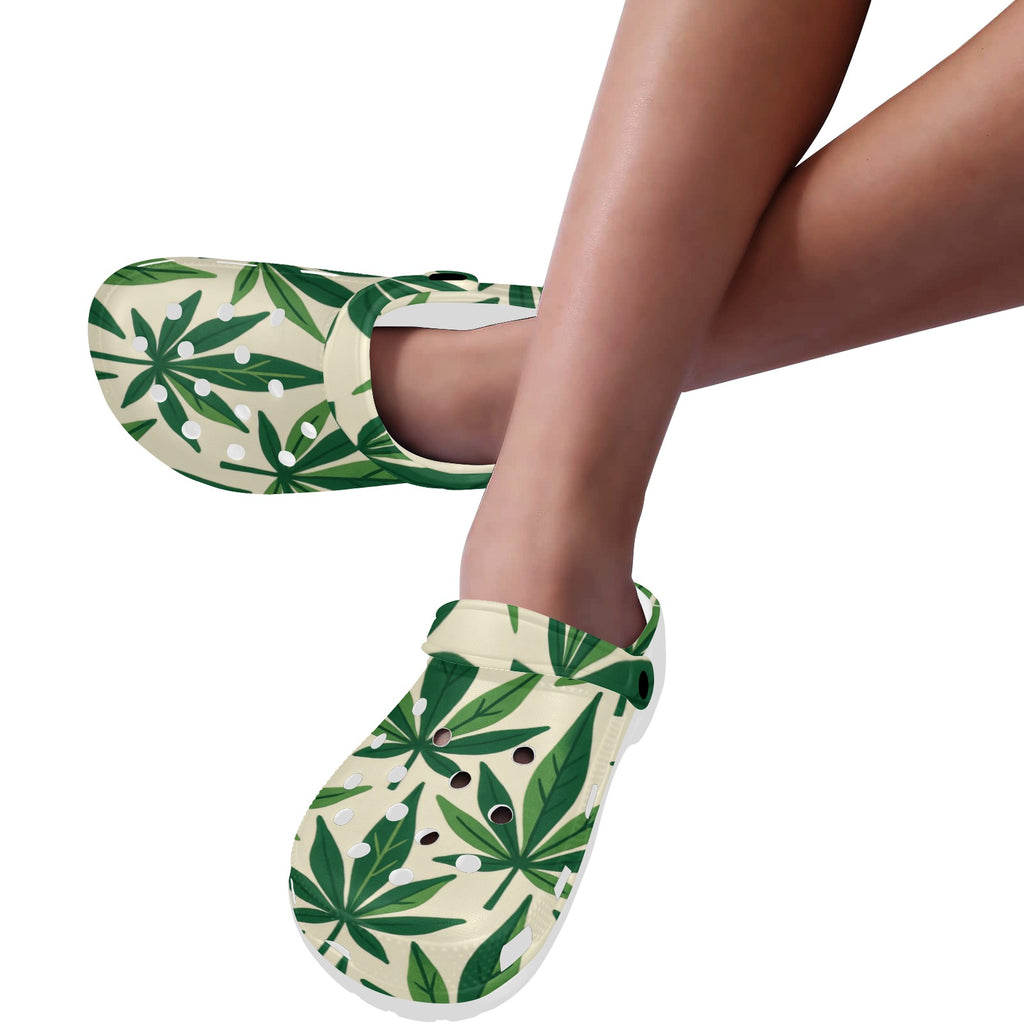 Green leaf-patterned slippers worn by a person on a white background