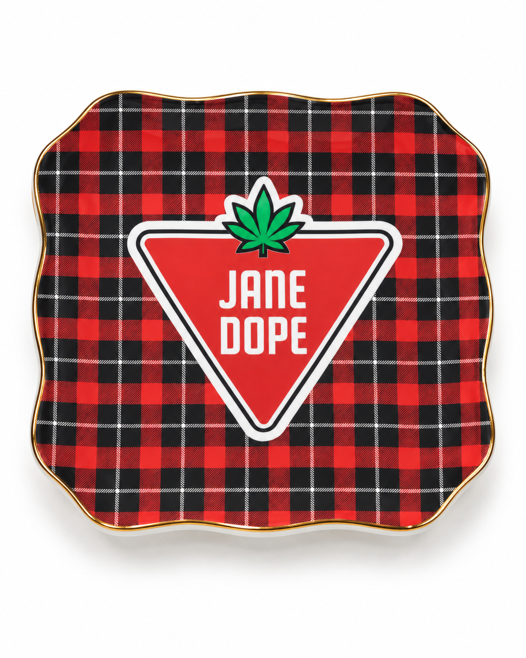 A square decorative plate with scalloped edges, featuring a red and black buffalo plaid pattern with a gold rim. In the center is a red triangular badge with white text reading 'JANE DOPE' and a green cannabis leaf above it.