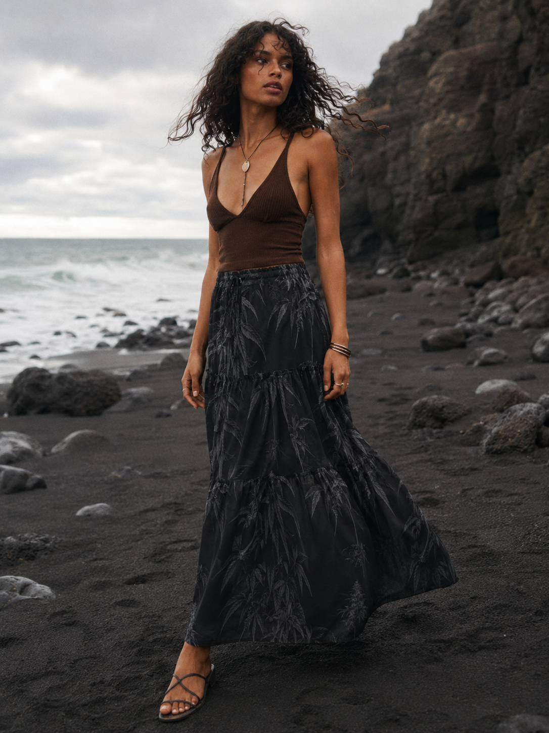 Ethereal smoke print tiered maxi skirt, three-quarter view on model outdoors