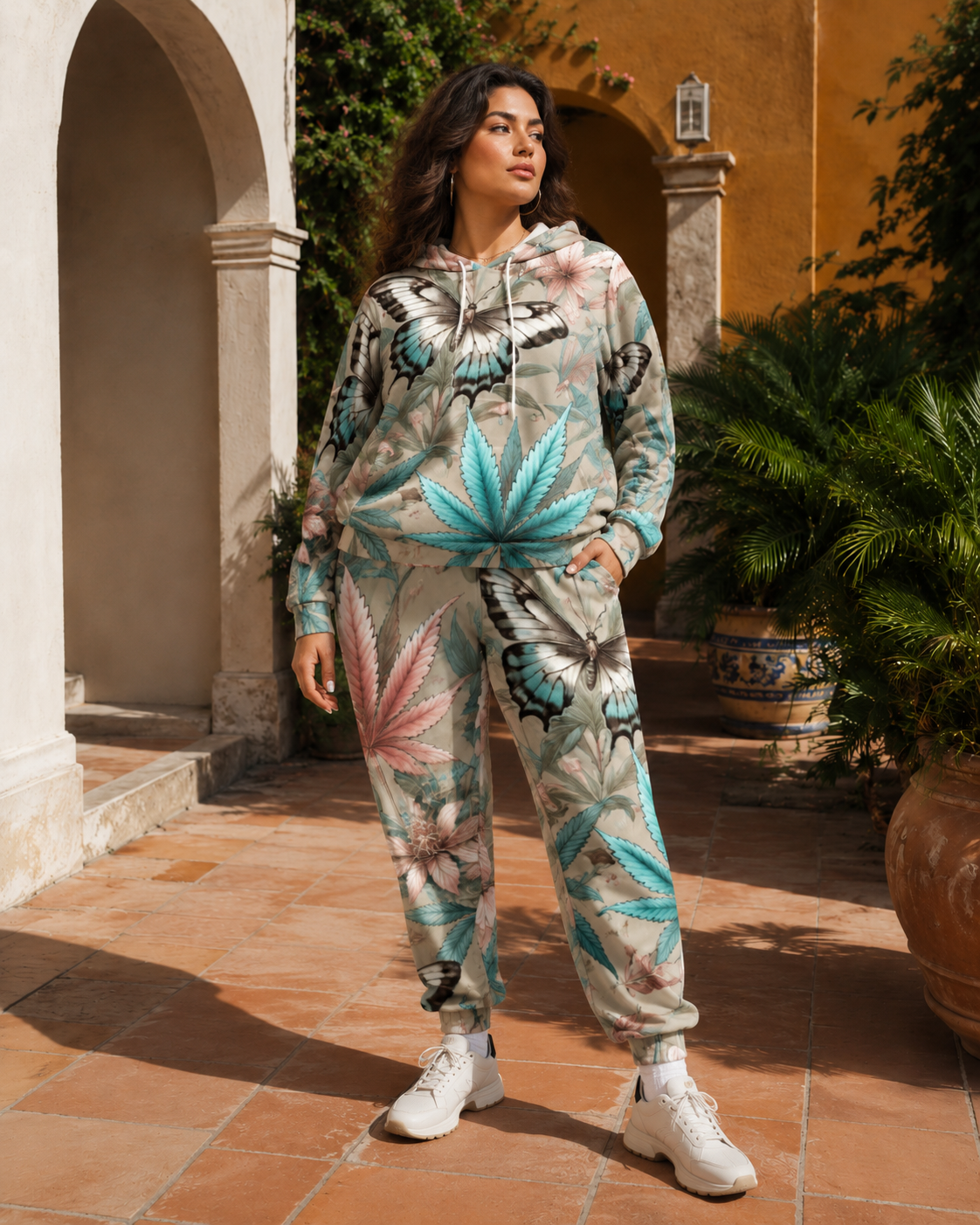 All-over print hoodie and sweatpants set, seated lifestyle shot on model