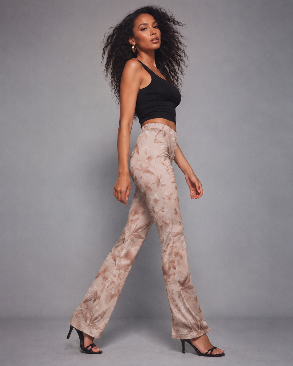 Rose graphic print flare pants, back view on model