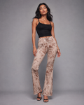 Rose graphic print flare pants, front view on model