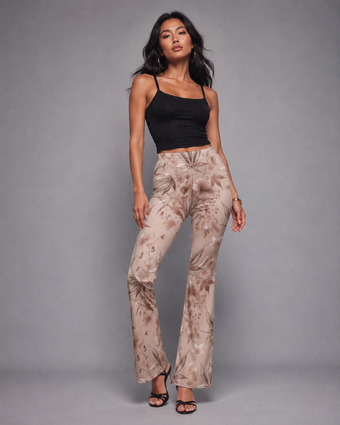 Rose graphic print flare pants, front view on model