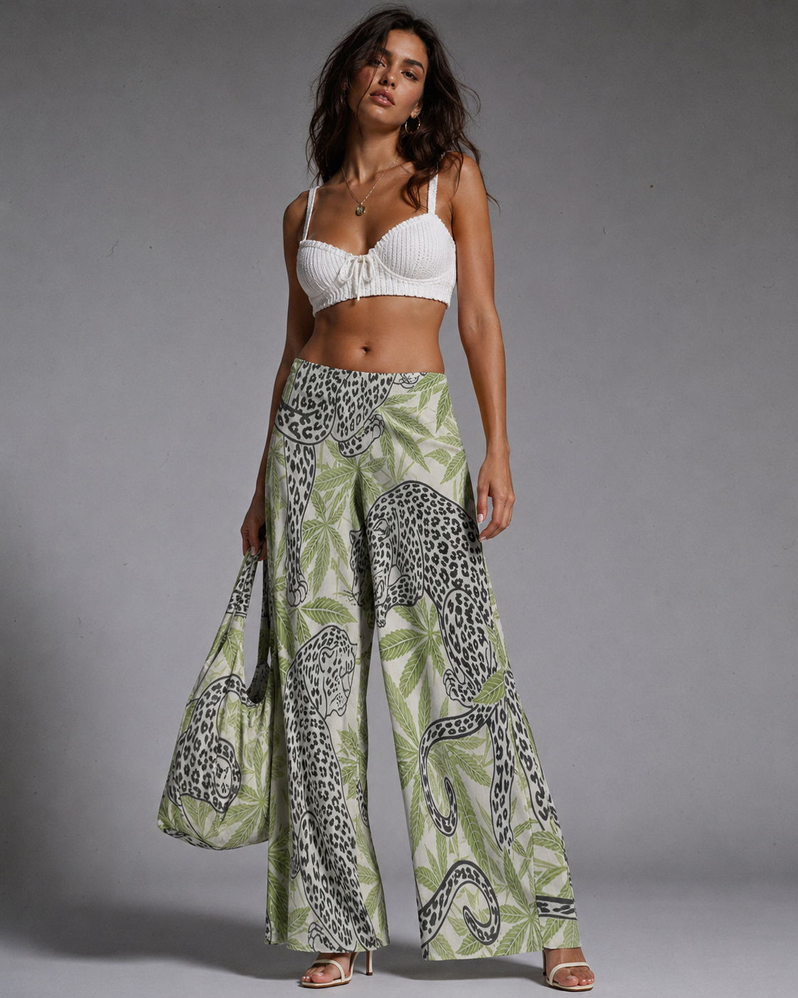 Leopard print wide leg pants, side view on model