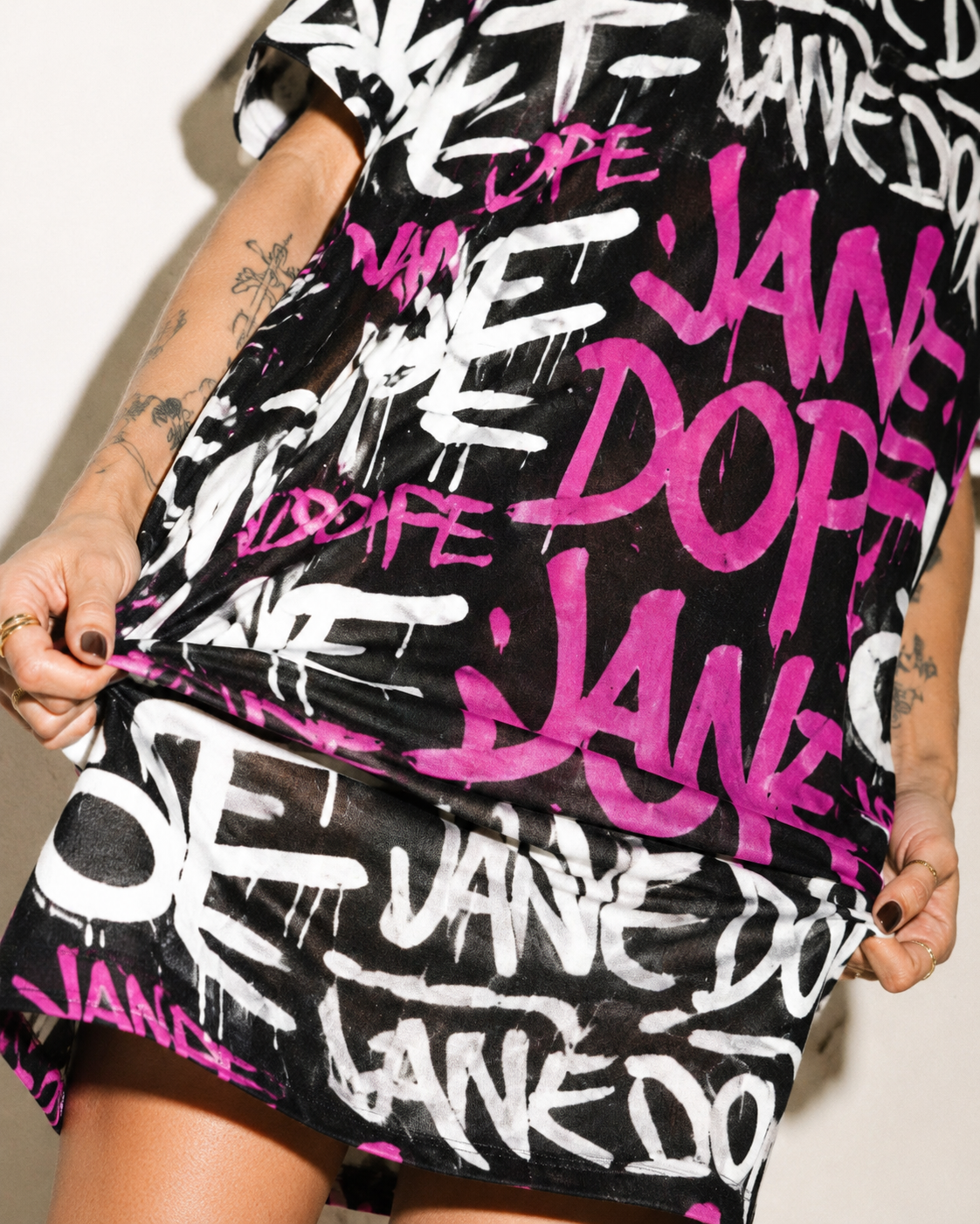 DANK! hot pink graffiti print pocket dress, close-up showing print and pocket detail