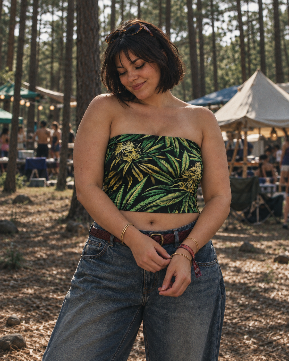 Big Buds green botanical print strapless crop top, front view as a model adjusts her bracelet