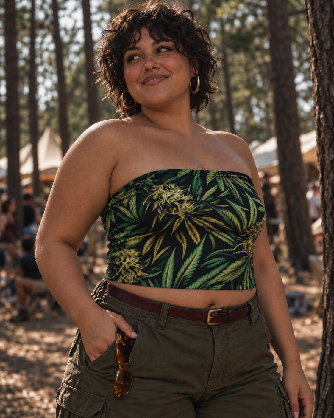 Big Buds green botanical print strapless crop top, three-quarter front view with sunglasses at a trouser pocket