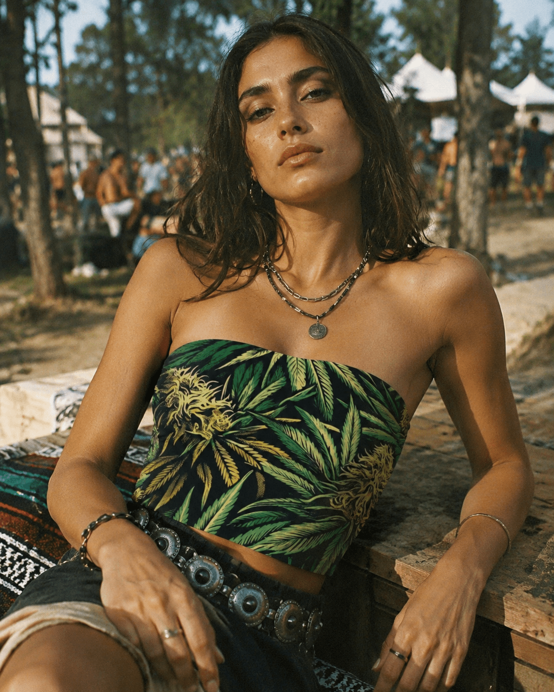 Big buds print tube crop top, seated lifestyle shot on model