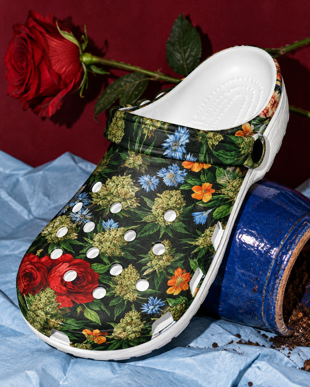 Bloom clog botanical print and white sole close-up beside a blue flowerpot