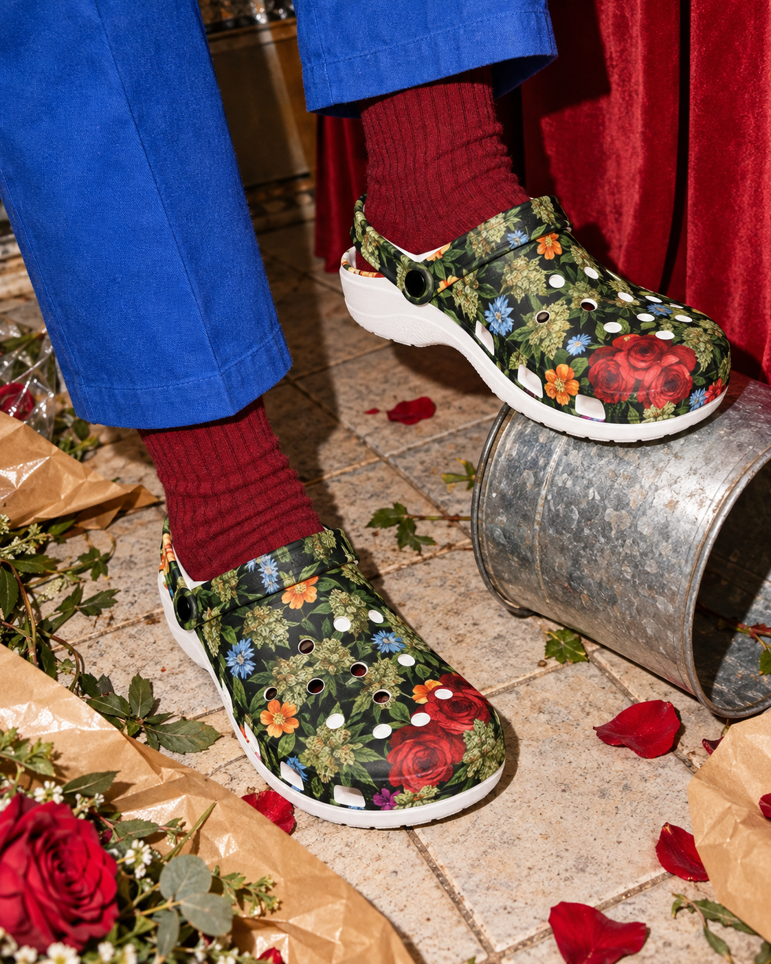 Bloom floral clogs styled with burgundy socks and cobalt trousers