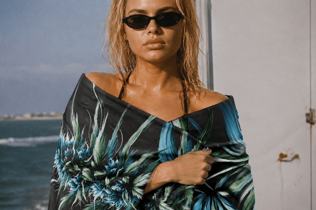 Blue dream floral print beach towel, draped lifestyle shot