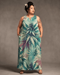 Cola Love graphic print long pocket dress, seated lifestyle shot on model