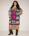 DANK! hot pink graffiti print pocket dress, seated lifestyle shot on model
