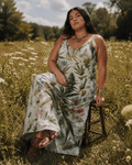 HER.B floral garden print long spaghetti strap dress, full length view on model outdoors