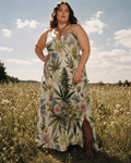 HER.B floral garden print long spaghetti strap dress, seated lifestyle shot on model