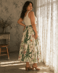 HER.B floral garden print pleated midi skirt, full length view on model outdoors