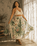 HER.B floral garden print pleated midi skirt, lifestyle editorial shot on model