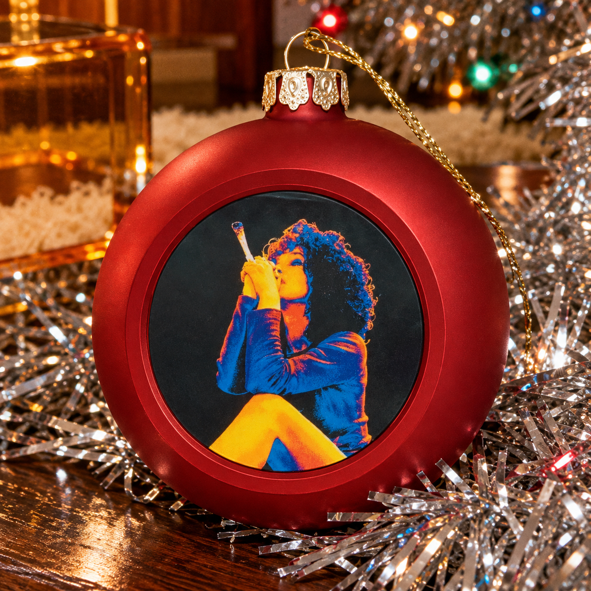 Hotbox Xmas Ornament in red showing the portrait print, raised rim and decorative cap