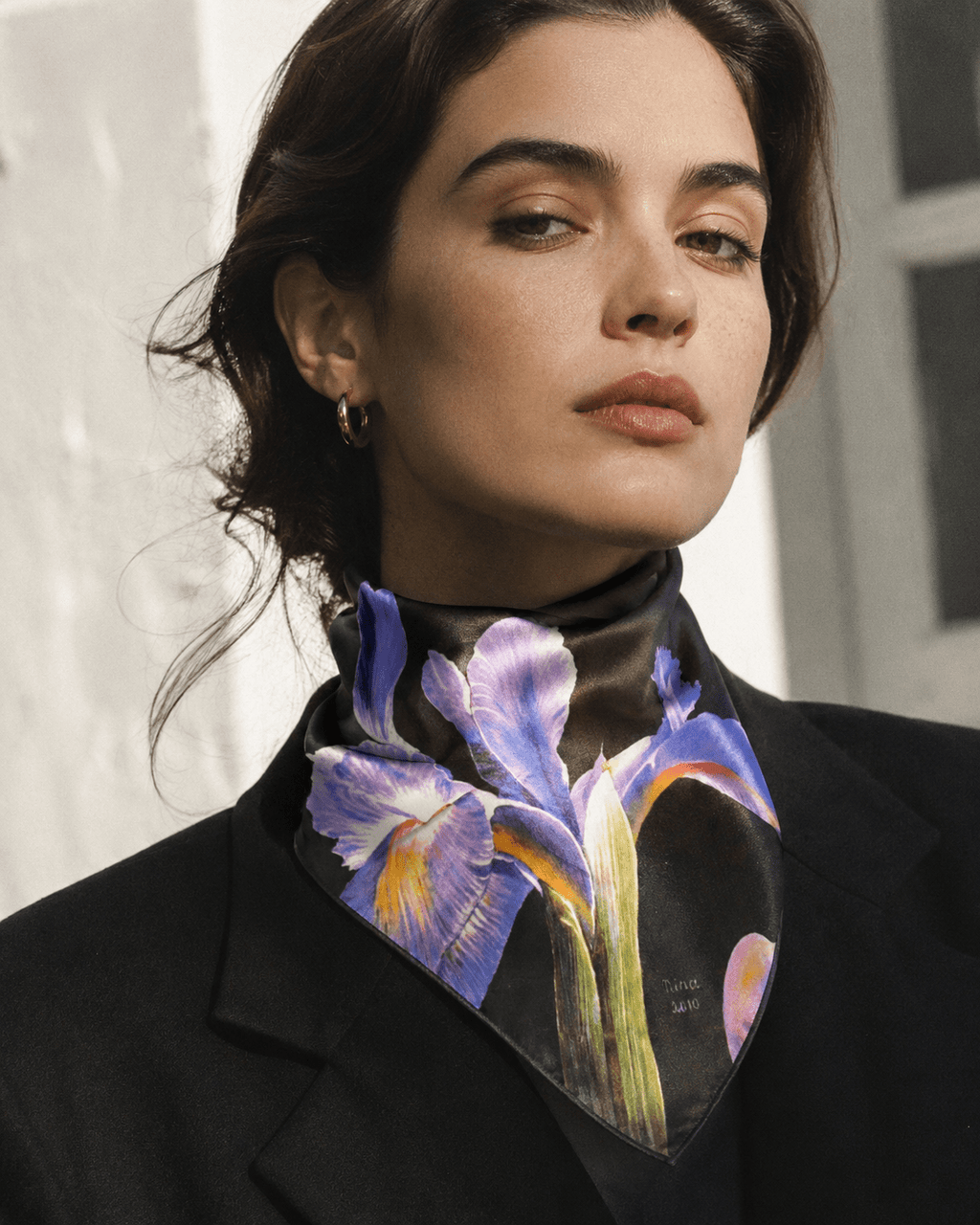 Iris floral print scarf, tied as neckerchief on model
