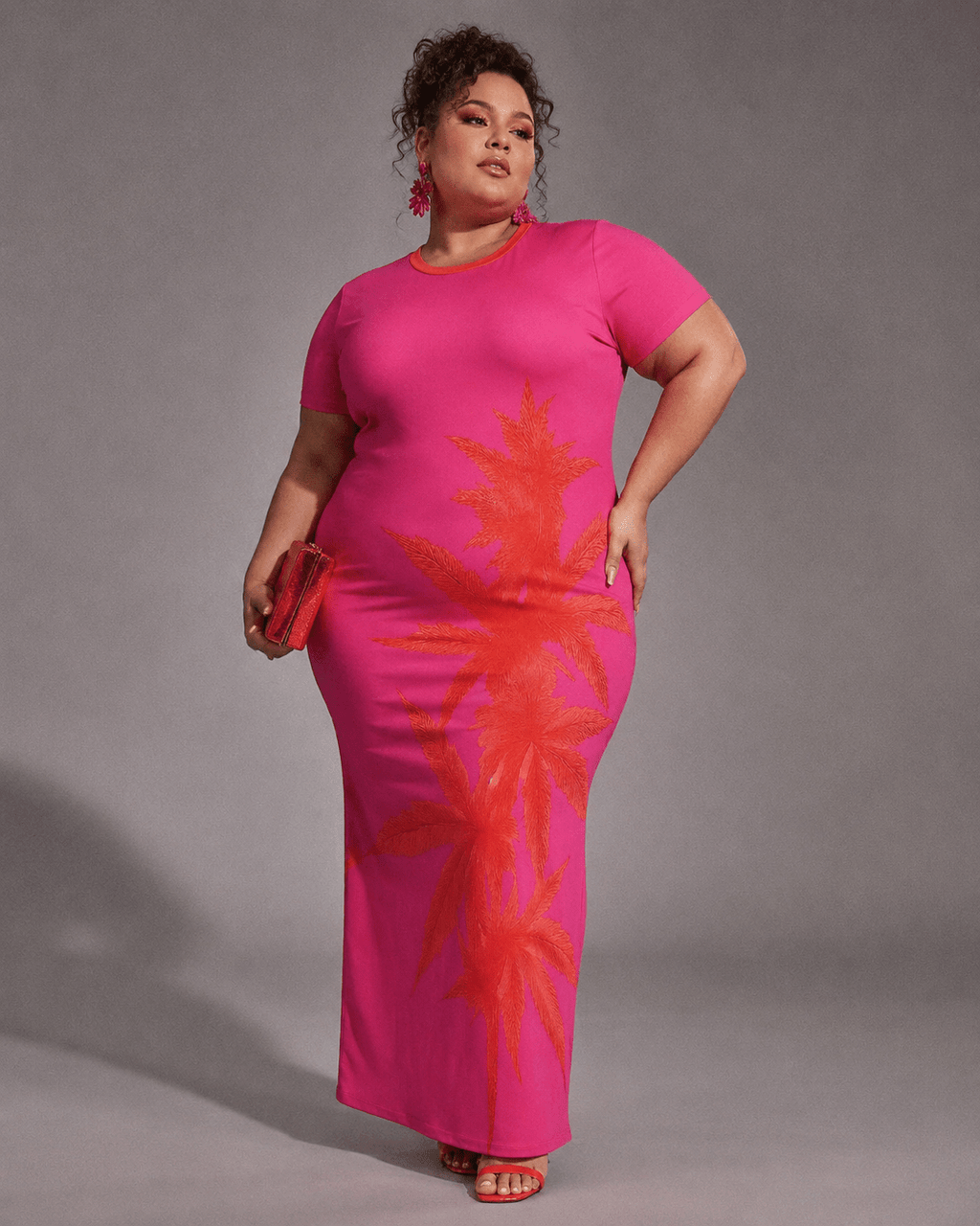 Pink tropical print bodycon dress, full length view on model outdoors
