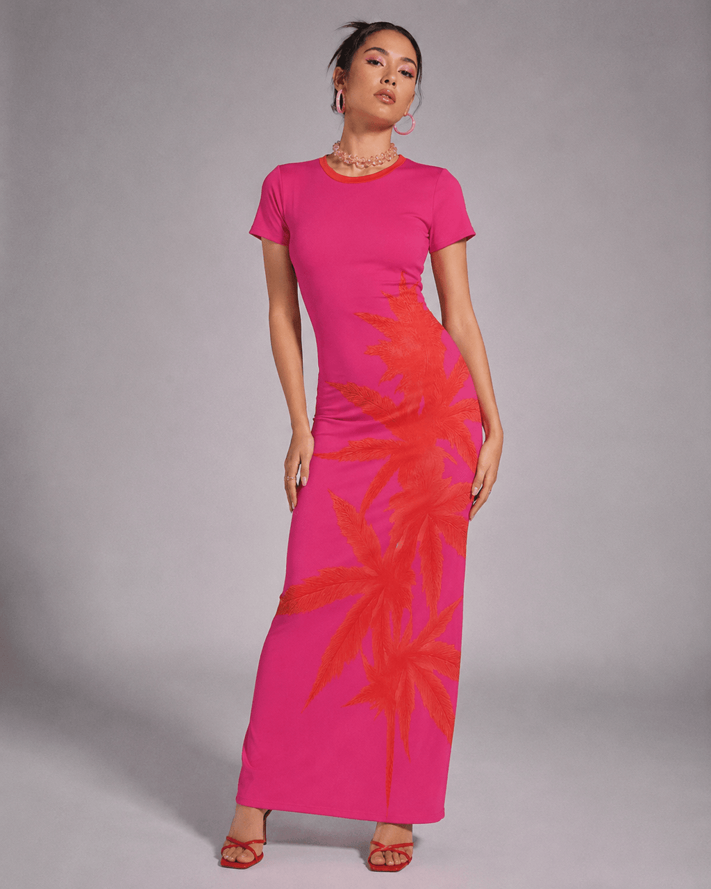 Pink tropical print bodycon dress, side view on model showing silhouette