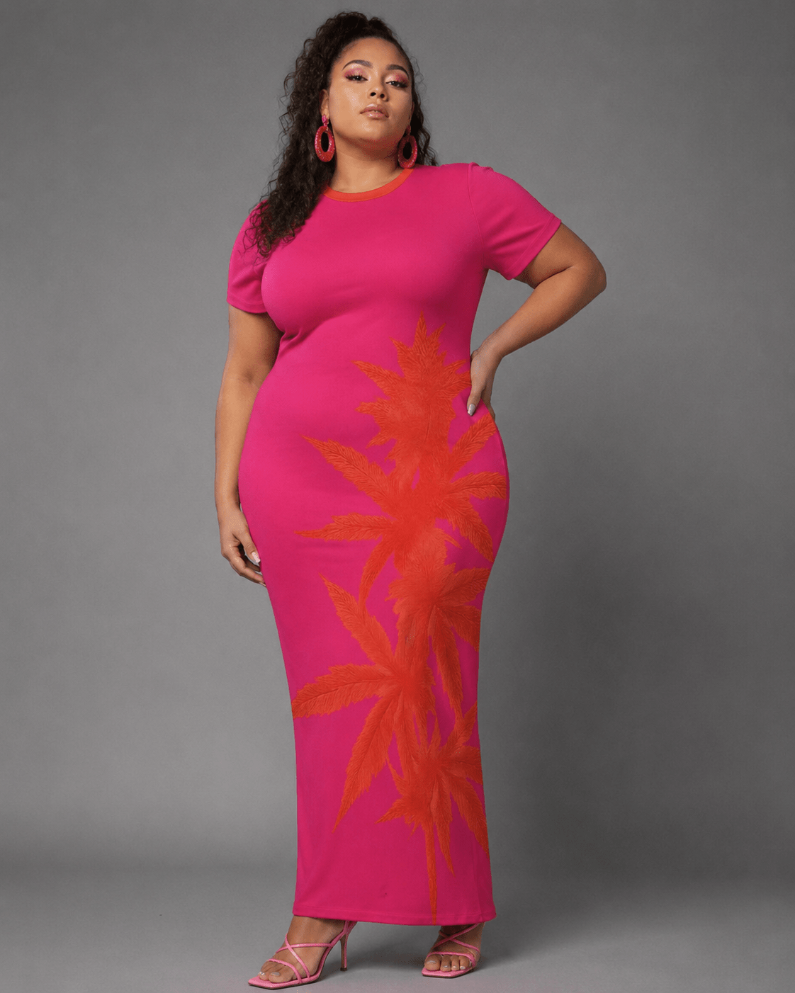 Pink tropical print bodycon dress, lifestyle editorial shot on model