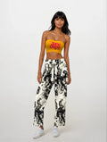 Jane Dope logo print strapless bandeau crop top, front view on model