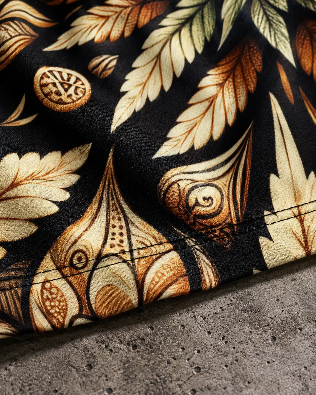 Jane Dope Batik Buds bodycon mini dress, close-up of stitched hem and paisley print.