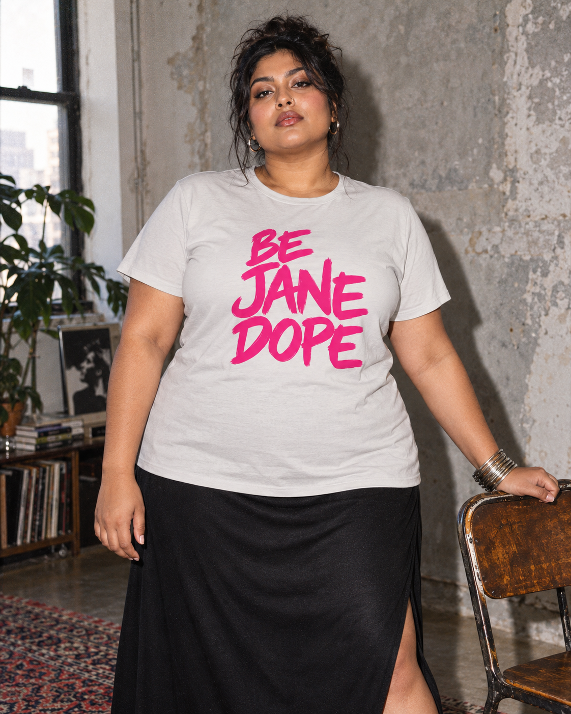 BE JANE DOPE pink-lettered tee styled with a long black skirt.