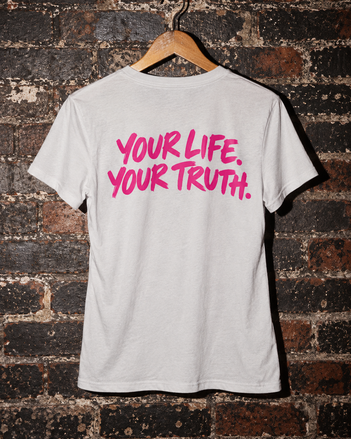 Full back of BE JANE DOPE tee with YOUR LIFE. YOUR TRUTH. artwork on a hanger.