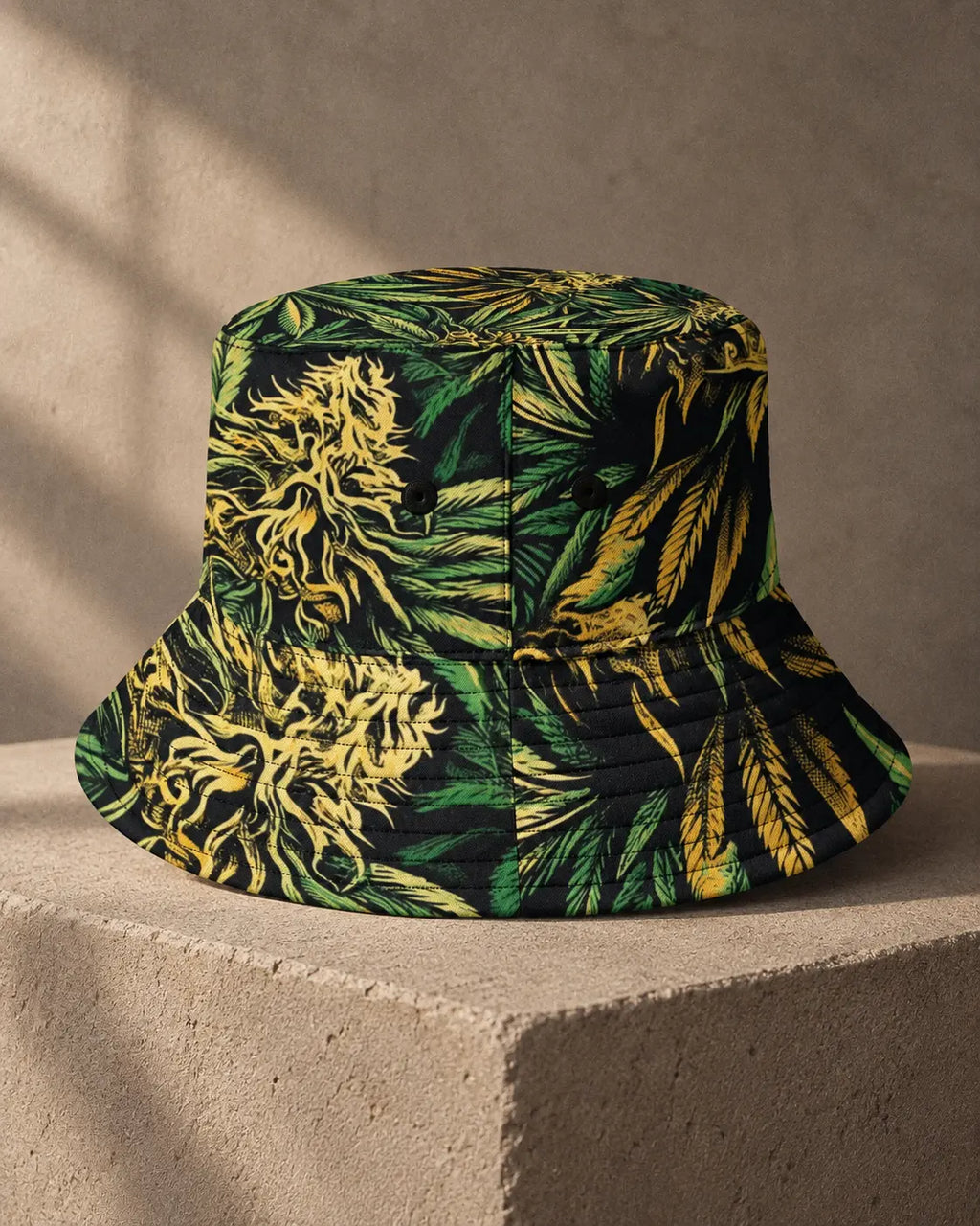 Jane Dope Big Buds Bucket Hat, front view showing green and yellow botanical print, black eyelets and stitched brim