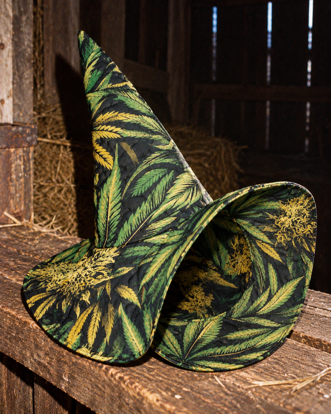 Big Buds quilted witch hat with its brim turned upward, showing the printed underside and stitching.