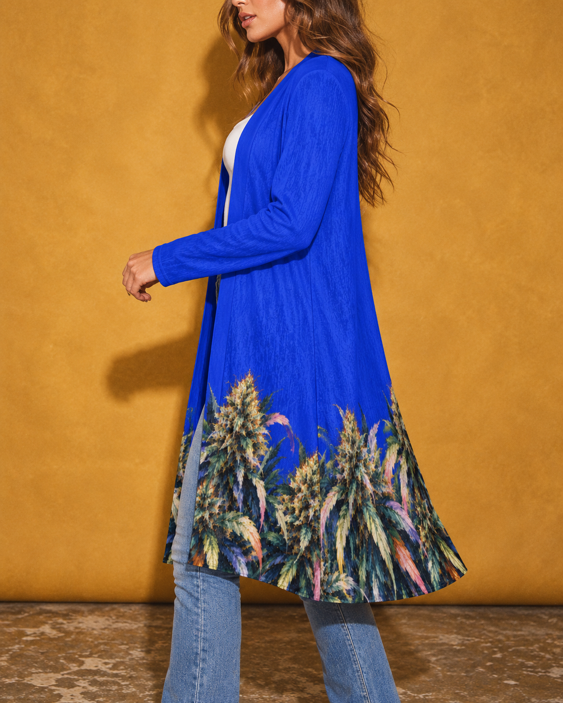 Close side view of the Blue Mazar cardigan showing the long sleeve, loose drape and printed hem.