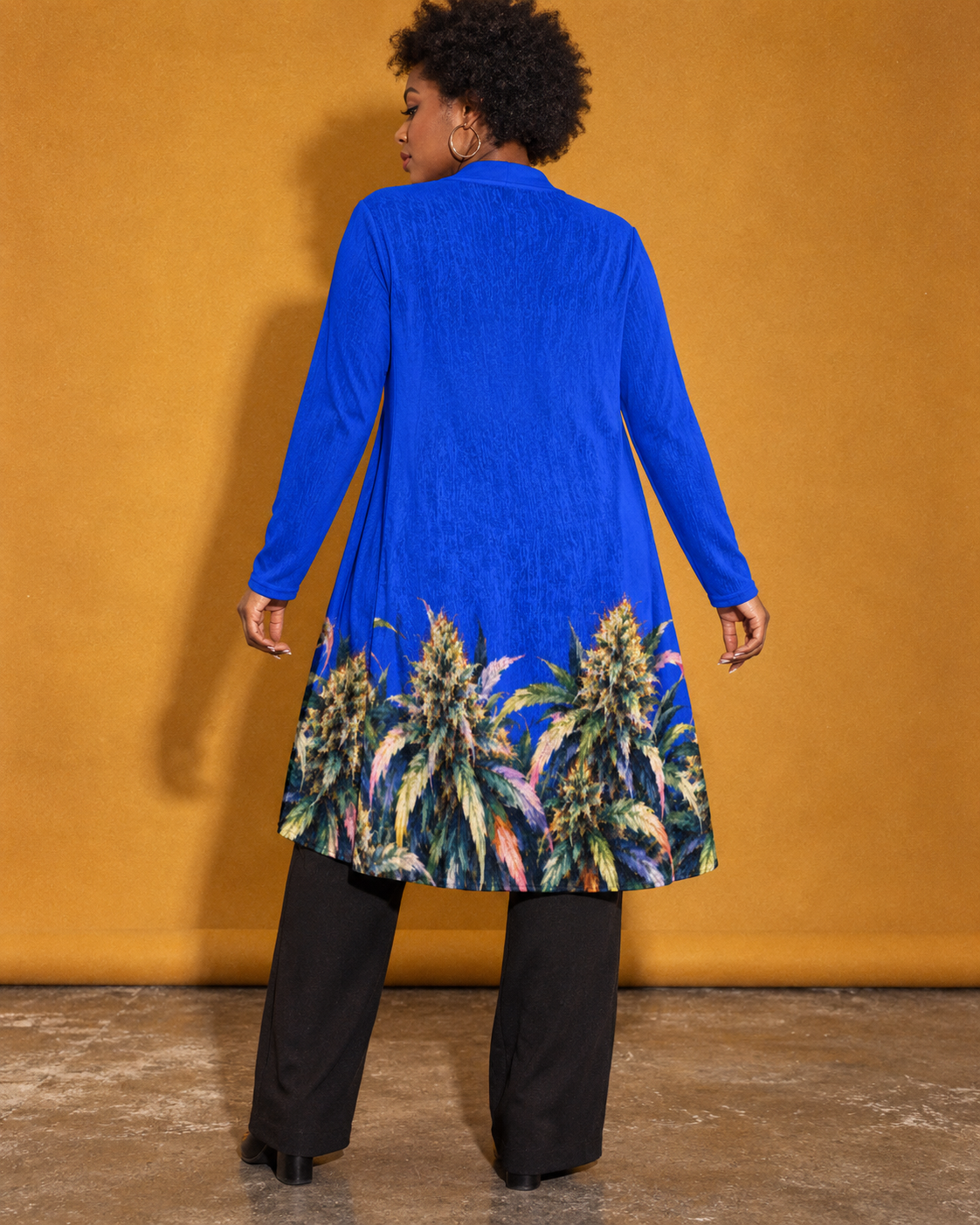 Back view of the Blue Mazar long-sleeve cardigan showing the Herb botanical border around the hem.
