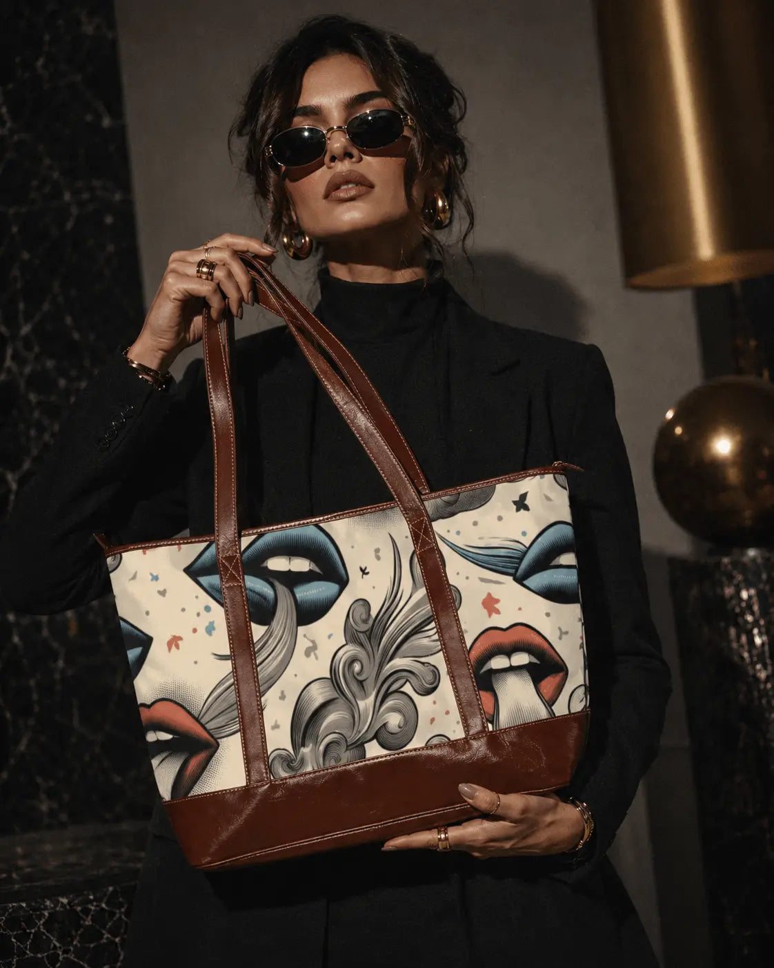 Jane Dope Boujie LUX Lips tote, held front-facing by a model in black tailoring and gold jewellery