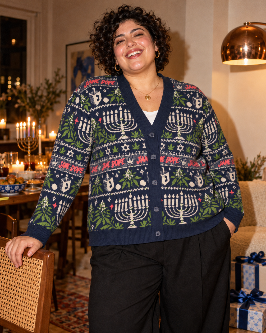 Front view of Get Lit cardigan styled with black trousers at a Hanukkah gathering.