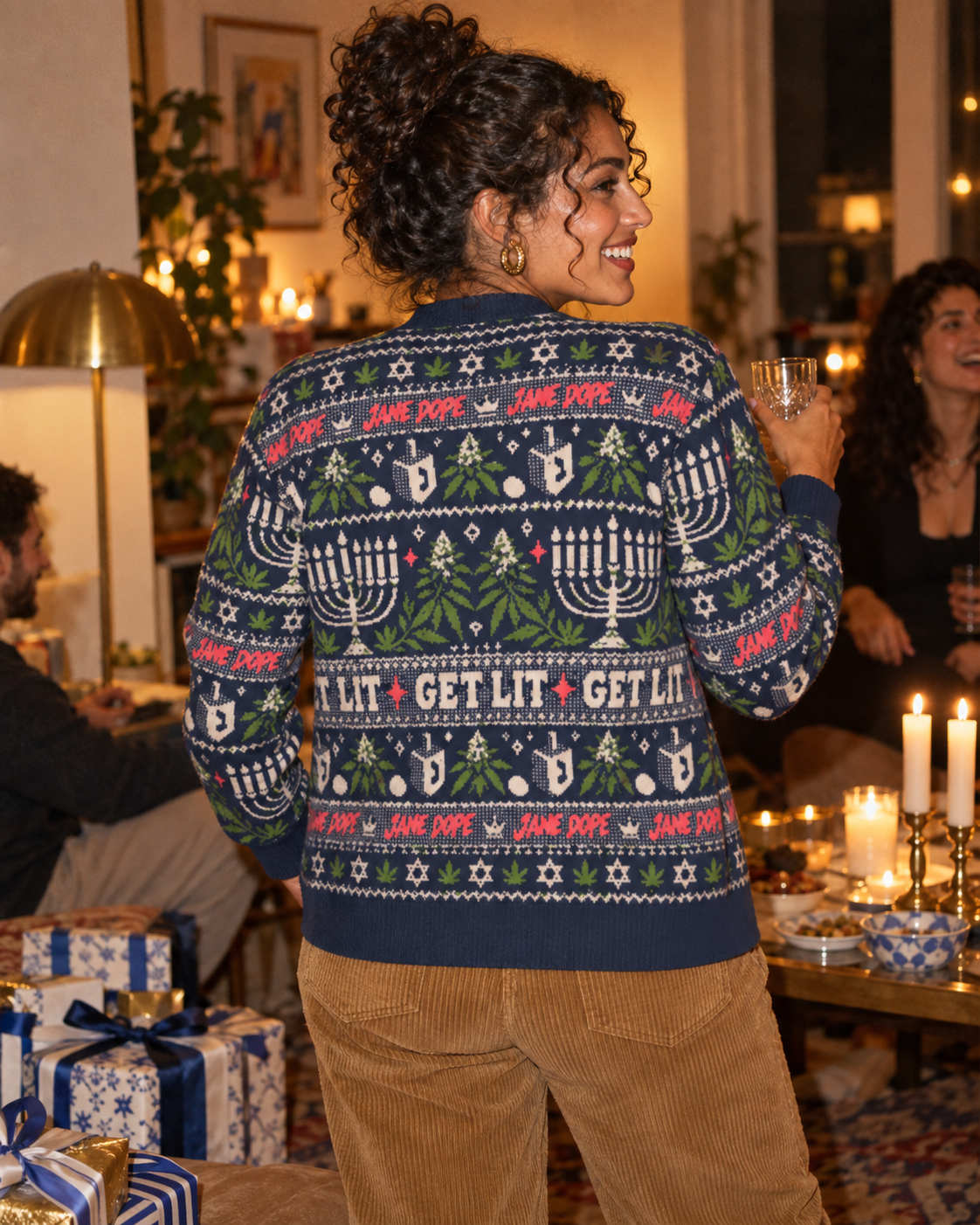 Back view of Get Lit cardigan showing cream lettering and festive jacquard artwork.