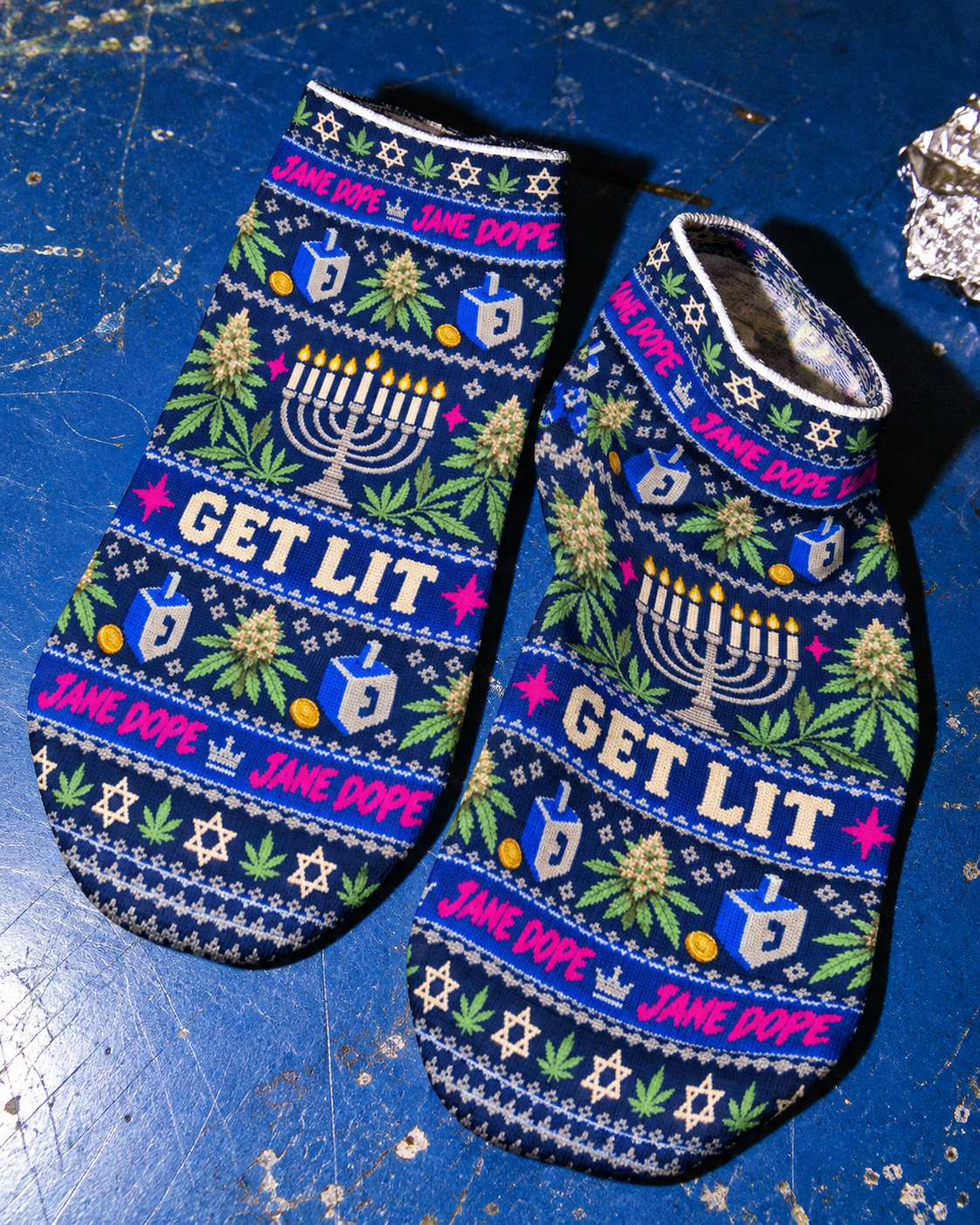 Close-up of Get Lit Hanukkah ankle socks showing the printed menorah, low cuff and smooth fabric.