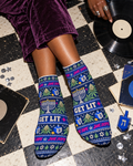 Overhead Get Lit Hanukkah ankle socks with purple trousers, records and silver confetti.