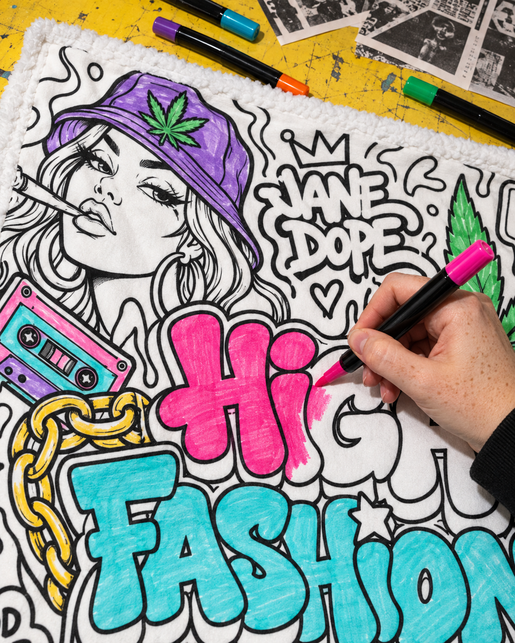Close-up colouring inspiration showing a hand filling the High Fashion lettering with a pink fabric marker; supplied uncoloured