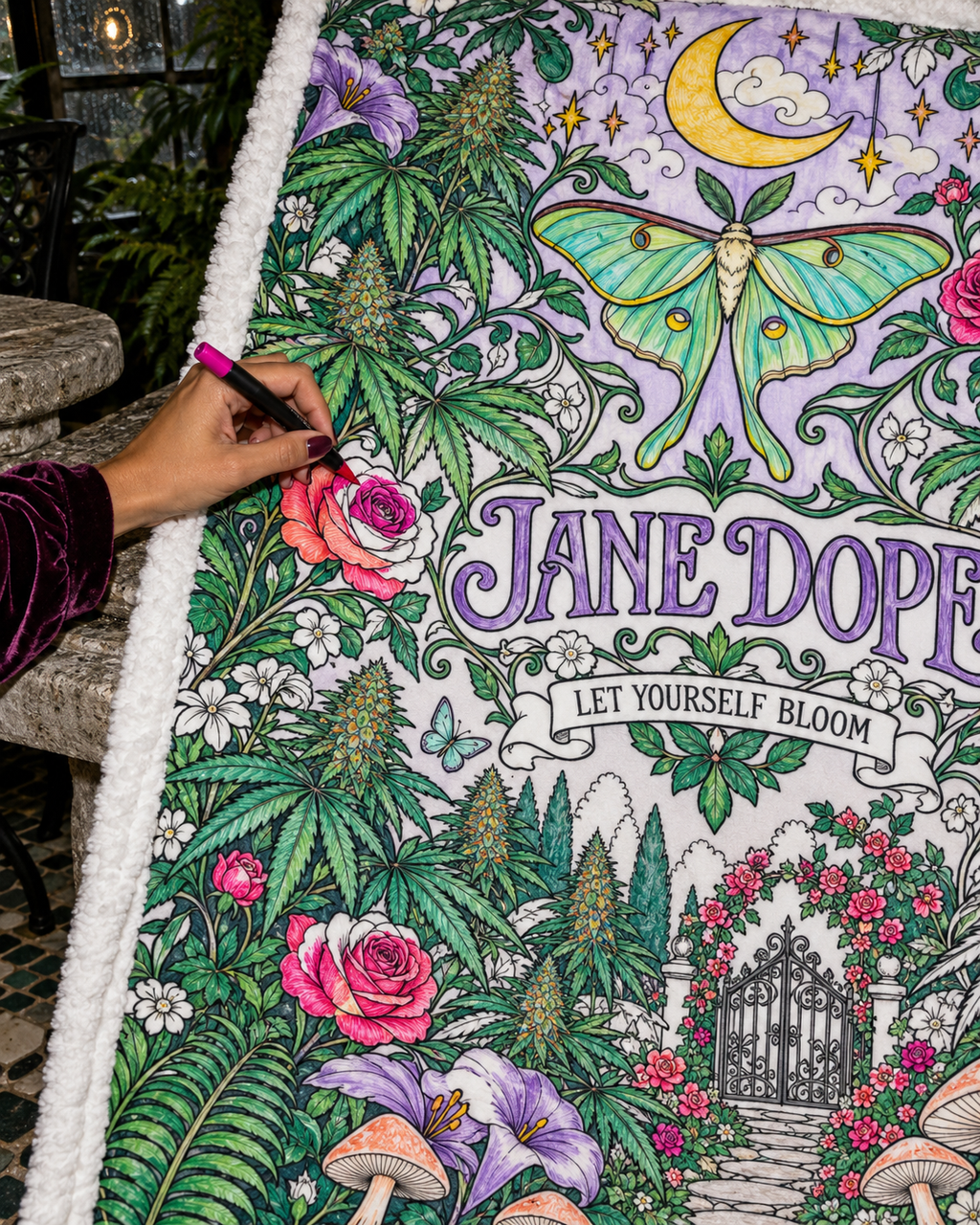 Close-up JD Magic colouring inspiration showing a hand filling a rose with magenta fabric marker; supplied uncoloured