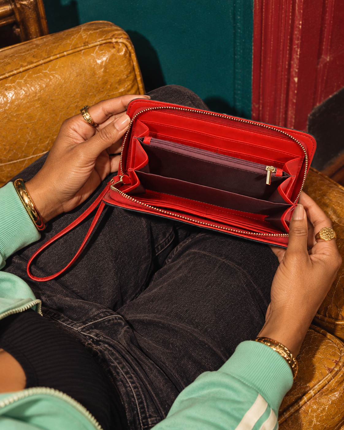 Open Leopard Clutch Wallet showing its red interior, card slots, divided compartments and central zip pocket.