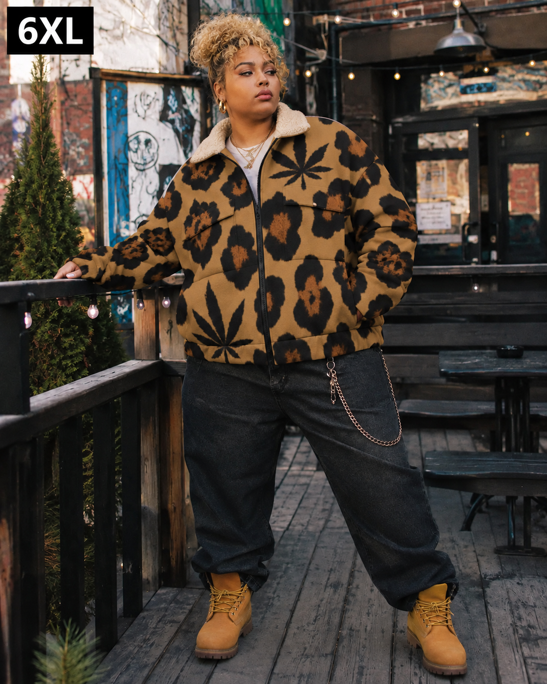 Jane Dope leopard-and-leaf jacket on model in 6XL, leaning on a patio railing