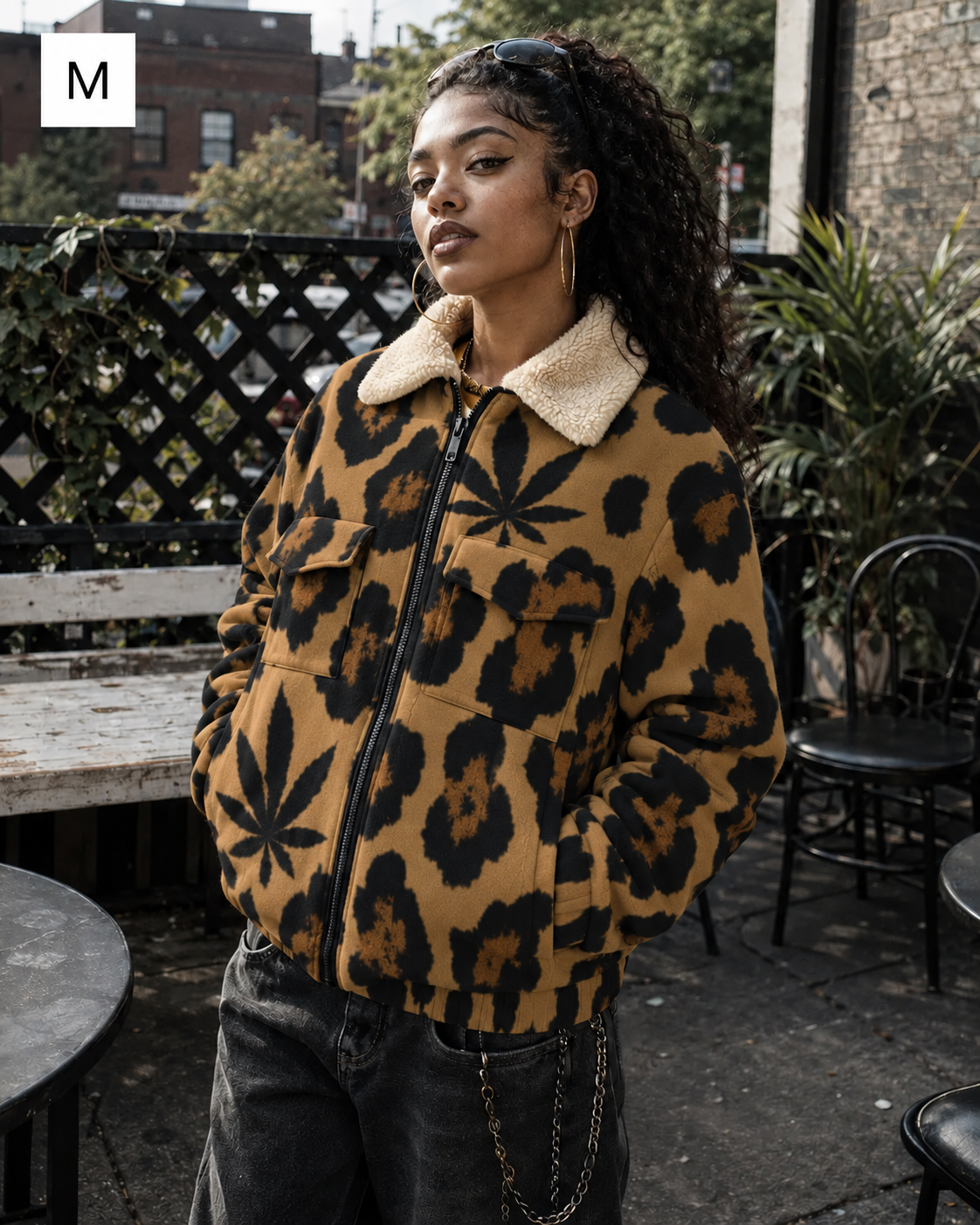Jane Dope leopard-and-leaf jacket on model in M, with buttonless flap pockets and sherpa collar