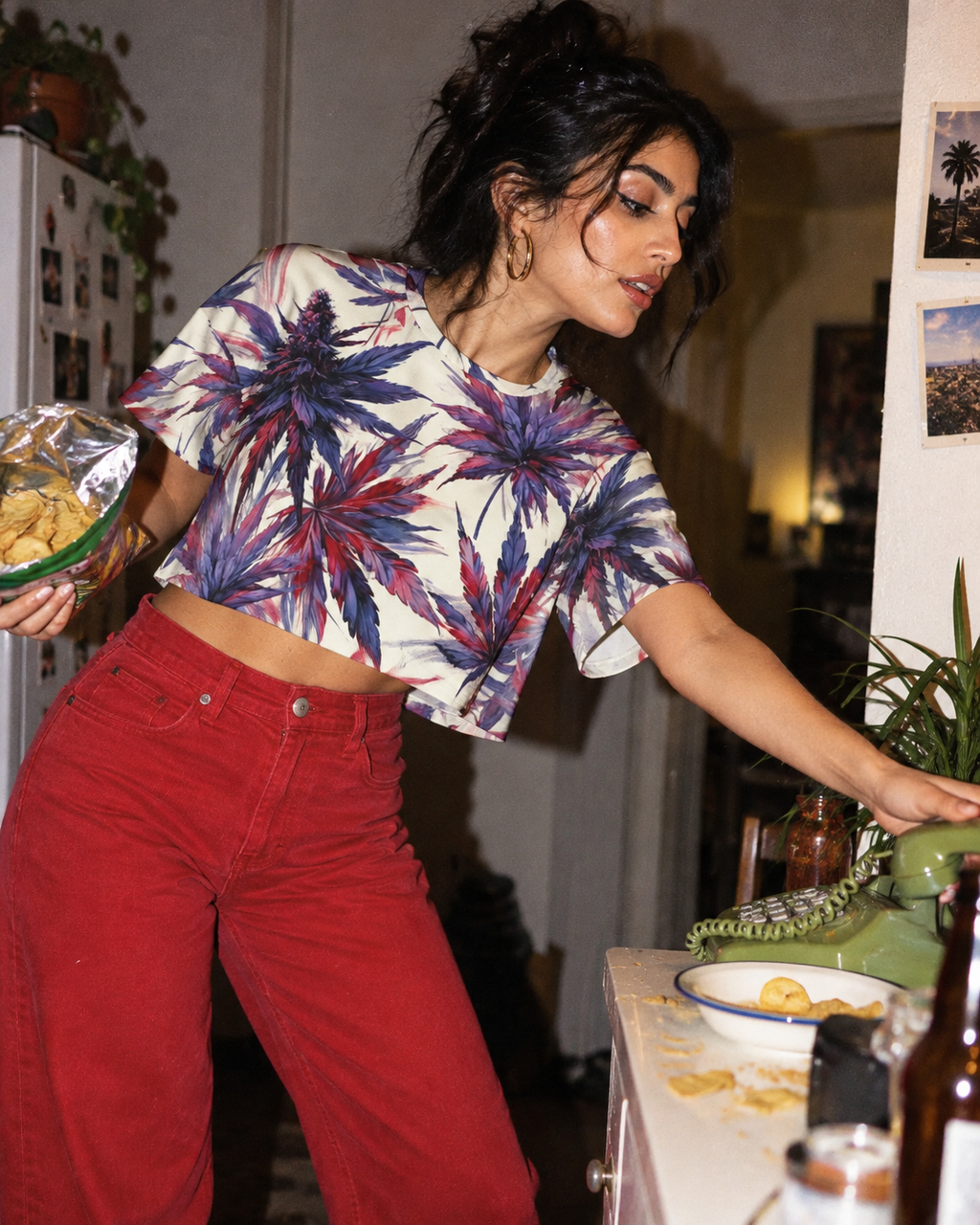 Mendo drop-shoulder sleeve and cropped hem while reaching for a green landline