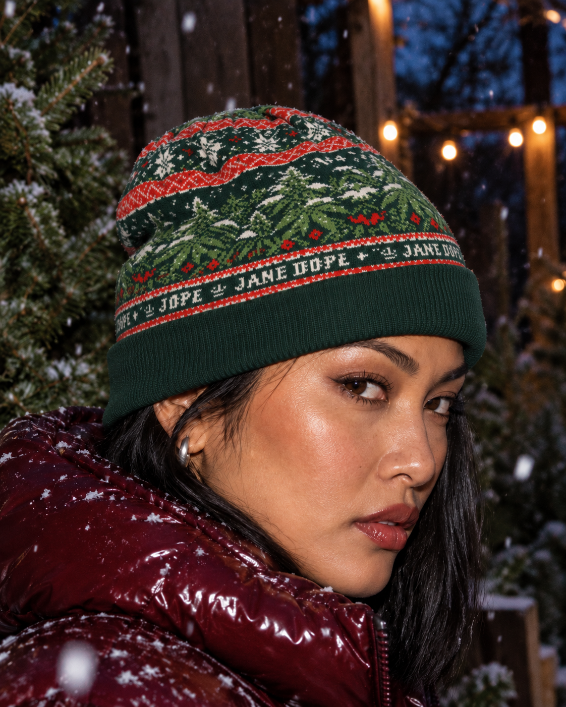 Nugs & Mistletoe Knit Beanie close side view worn with the folded cuff covering the top of the ear